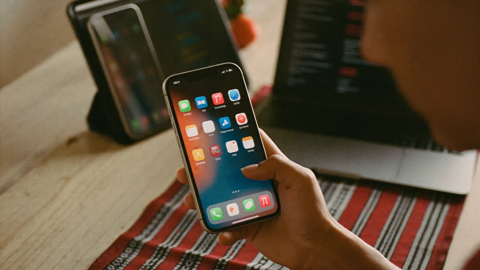 Hand holding a phone with a freshly built app